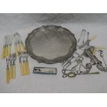 A good quality silver plated circular tea tray with engraved decoration and a selection of various