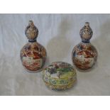 A pair of 19th Century Japanese Imari china double gourd spill vases with painted floral decoration,
