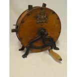 A Victorian oak circular knife cleaner with metal stand