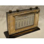 An Edward VII silver mounted rectangular perpetual desk calendar with ebonised mounts,
