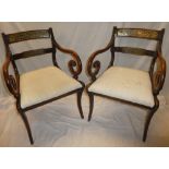 A set of four single and two carver early to mid 19th Century dining chairs,