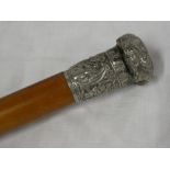 A gentleman's Malucca walking cane with Chinese silvered top decorated in relief with figures and