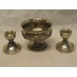 A pair of small silver squat-shaped candlesticks,