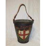 A 19th Century leather fire bucket with painted coat of arms "1885 1897-98" and leather handle