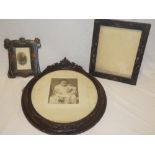 A good quality oval picture frame in ornate leaf mounted frame,