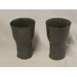 A pair of Art Nouveau pewter tapered goblets with raised floral decoration marked "Osiris 504",