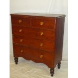 A 19th Century stained pine chest of two short and three long drawers with turned handles on turned