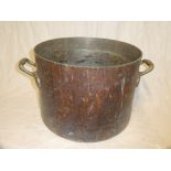 A large 19th Century copper two-handled cooking pan,