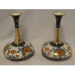 A pair of Macintyre china tapered spill vases with floral, gilt and blue decoration,