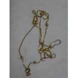 A 9ct gold chain link necklace with raised spherical decoration