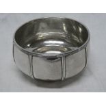 A George V silver circular bowl with ribbed decoration,