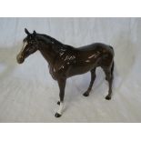 A large Beswick china figure of a brown horse,