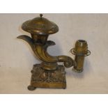 A 19th Century oil/candle lamp of cornucopia form on square shaped base