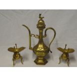 A pair of small Chinese brass candle holders on three scroll legs and an Eastern brass