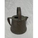 An old copper water container with loop handle marked "GUNr T"