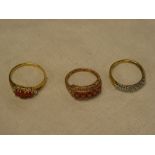 Two various 9ct gold dress rings set garnets and one other dress ring (3)