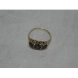 A 9ct gold dress ring set three amethyst and four diamond chips
