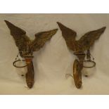 A pair of old quality brass wall mounted light fittings in the form of eagles with outstretched