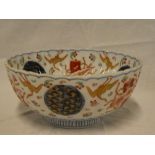 A late 19th Century Japanese Imari circular bowl with painted decoration,