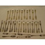 A set of late Victorian silver table cutlery comprising twelve silver dinner forks and twenty-four