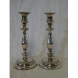 A pair of George III silver baluster-shaped candlesticks with decorated edges, Sheffield marks 1811,