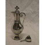 A late Victorian baluster-shaped communion-style jug and stopper with scroll handle on circular