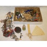 A box containing a large selection of various costume jewellery,