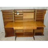 A 1960's Danish "Magic Box" folding desk by Mummenthaler & Meier with fitted compartments,