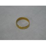 A large 22ct gold wedding band