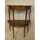 A pair of 19th Century mahogany semi-circular dining table ends, joining with brass catches,