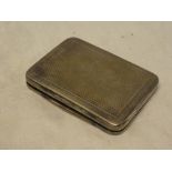 A George V silver rectangular pocket box with engine turned decoration, 3" long,