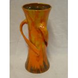 A Branham Barnstaple pottery tapered vase with three loop handles on orange and brown ground,