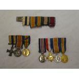 A First War period miniature Military Cross and pair of medals with mentioned in despatches emblem