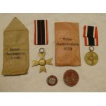 A Second War German War Merit Cross without swords in original packet,