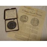 An iron Lusitania medal in fitted case with 1915 German Naval Victory hand bill