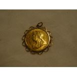 A Victorian 1899 gold sovereign within clipped gold pendant mount