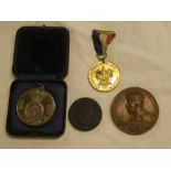 A large bronze 1911 George V Coronation medallion, 1994 D-Day commemorative medallion,