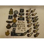 A selection of various RAF cloth badges including period and modern wings, buttons,