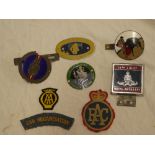 An embroidered AA badge, RAC badge,