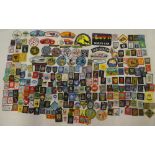 A large selection of various Boy Scout and Girl Guide cloth badges and insignia,