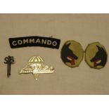 An unusual SS Commando silver sweetheart's brooch, a pair of painted oval formation signs,