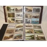 Two large albums containing a large selection of black and white and coloured postcards including