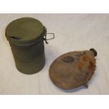 A First War German enamelled canteen with original fabric covering and a First War German gas mask