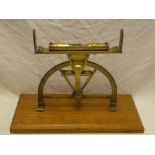 Am old brass curved level from a mining dial with calibrated scale and spirit level