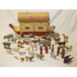 An old painted wood Noah's Ark with hinged roof 18½" long containing a selection of various wooden