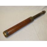 A 19th century brass and mahogany single-draw telescope