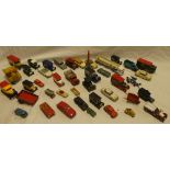 A selection of various diecast vehicles including Dinky missile carrier, Dinky wheelbarrow,