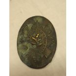 An early 19th century brass oval shoulder belt plate of the Scot's Guards,