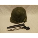 An American steel combat helmet and a British No.