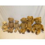 A selection of various old plush covered teddy bears